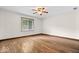 Bedroom with tile floors, ceiling fan and large window with blinds at 110 Leichester Ct, Noblesville, IN 46060