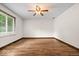 Bedroom with tile floors, ceiling fan and large window with blinds at 110 Leichester Ct, Noblesville, IN 46060