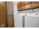 Laundry room featuring a washer, dryer and overhead cabinets at 110 Leichester Ct, Noblesville, IN 46060