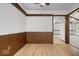 Inviting bonus room with wood paneling, light wood flooring and natural light at 110 Leichester Ct, Noblesville, IN 46060