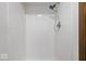 Shower with white tiled walls and modern shower head at 110 Leichester Ct, Noblesville, IN 46060