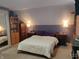 Cozy bedroom featuring a large bed with nightstands and lamps for a relaxing ambiance at 121 N Main St, Pendleton, IN 46064