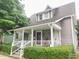 Charming home featuring a welcoming front porch and well-maintained landscaping at 121 N Main St, Pendleton, IN 46064