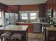 Spacious kitchen with stainless steel appliances and an island with seating at 121 N Main St, Pendleton, IN 46064