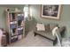 Comfortable living room with natural lighting, shelving, and a cozy futon sofa at 121 N Main St, Pendleton, IN 46064