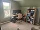 Inviting office space with a dual monitor setup, natural light, and ample storage at 121 N Main St, Pendleton, IN 46064