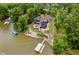 Waterfront property with decks, terraced landscaping, and a private dock at 121 Wesley Cir, Noblesville, IN 46062