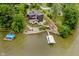 Aerial view of the property with a dock, waterfront access and mature trees at 121 Wesley Cir, Noblesville, IN 46062