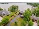 Aerial view of a modern home with a waterfront view and lush landscaping at 121 Wesley Cir, Noblesville, IN 46062
