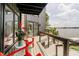 Balcony with red chairs overlooking the lake at 121 Wesley Cir, Noblesville, IN 46062