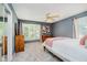 Cozy bedroom with a ceiling fan, a window with blinds, and neutral-colored walls at 121 Wesley Cir, Noblesville, IN 46062