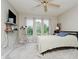 Bright bedroom with a large window, ceiling fan, and carpet flooring at 121 Wesley Cir, Noblesville, IN 46062
