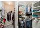 Spacious walk-in closet with shelving, hanging rods, and carpet flooring at 121 Wesley Cir, Noblesville, IN 46062