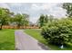 Scenic view of a private driveway leading to a home, surrounded by lush landscaping at 121 Wesley Cir, Noblesville, IN 46062