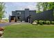 Modern two-story home with black siding, landscaped lawn, and asphalt driveway at 121 Wesley Cir, Noblesville, IN 46062