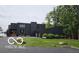 Modern, dark-colored home with well-maintained lawn and beautiful landscaping at 121 Wesley Cir, Noblesville, IN 46062
