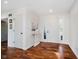 Bright entryway featuring hardwood floors, white walls, and a decorative console table at 121 Wesley Cir, Noblesville, IN 46062