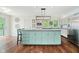 Kitchen with island, stainless steel appliances, and ample natural light with access to balcony at 121 Wesley Cir, Noblesville, IN 46062