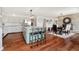 Open kitchen with seating, stainless appliances, hardwood floors, and easy access to the dining room at 121 Wesley Cir, Noblesville, IN 46062