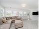 Comfortable living room featuring a large sectional couch and outdoor access at 121 Wesley Cir, Noblesville, IN 46062