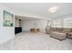 Inviting living space with a dining table, sectional couch, and bar area at 121 Wesley Cir, Noblesville, IN 46062