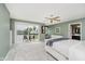Main bedroom with glass doors opening onto a balcony overlooking the water at 121 Wesley Cir, Noblesville, IN 46062