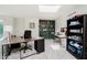 Spacious office area with two desks, built-in shelving, and a skylight at 121 Wesley Cir, Noblesville, IN 46062