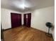 Bedroom featuring hardwood floors and ample natural light, creating a simple and functional space at 1227 W 9Th St, Anderson, IN 46016