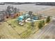 Aerial view showcases the large lot with multiple buildings, circular drive, and potential for further development or enjoyment at 12471 N 100 E, Alexandria, IN 46001