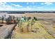 Aerial view highlighting the property's buildings, landscaping, and surrounding fields, offering a sense of privacy and space at 12471 N 100 E, Alexandria, IN 46001