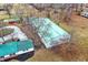 Aerial shot of property featuring large barns and lush greenery at 12471 N 100 E, Alexandria, IN 46001