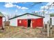 Large white and red barn featuring a wide sliding door at 12471 N 100 E, Alexandria, IN 46001