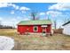 Rustic red barn with a green roof and a convenient side entrance at 12471 N 100 E, Alexandria, IN 46001