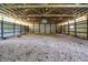 Spacious barn interior with high ceilings and open layout, perfect for various activities or storage at 12471 N 100 E, Alexandria, IN 46001
