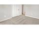 Bedroom with gray carpet and neutral walls, featuring closet with paneled, double doors at 12471 N 100 E, Alexandria, IN 46001