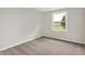 Bedroom with gray carpet, neutral walls, and window with view of green field at 12471 N 100 E, Alexandria, IN 46001