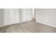 Bedroom with gray carpet and neutral walls, featuring closet with paneled, double doors at 12471 N 100 E, Alexandria, IN 46001