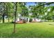 Charming single-story home with a green metal roof, fresh white paint, and a well-maintained lawn at 12471 N 100 E, Alexandria, IN 46001