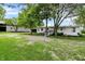 Ranch house with white siding, black garage door, and handicap ramp at 12471 N 100 E, Alexandria, IN 46001