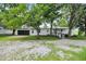 Ranch house with white siding, black garage door, and handicap ramp at 12471 N 100 E, Alexandria, IN 46001