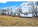 Charming single-story home with brick accents and well-maintained landscaping, set against a blue sky at 12471 N 100 E, Alexandria, IN 46001
