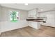 Bright kitchen with white cabinets, butcher block countertops, and new flooring at 12471 N 100 E, Alexandria, IN 46001