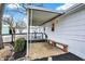 Covered patio with seating and decorative elements, creating a cozy outdoor space at 12471 N 100 E, Alexandria, IN 46001