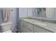 Modern bathroom with double granite vanity, large mirror, and colorful shower curtain at 1306 Avocet Dr, Greenwood, IN 46143