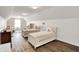 Spacious bedroom featuring two twin beds, wood floors, and a cozy, well-lit atmosphere at 13191 Roma, Carmel, IN 46074