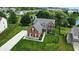 Inviting two-story home with a well-maintained lawn, mature trees, and a side-entry garage at 13191 Roma, Carmel, IN 46074