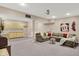 Cozy living room with plush seating, wet bar, and fun décor, perfect for relaxation and entertaining at 13191 Roma, Carmel, IN 46074