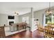 Open concept living room and dining area with wood floors and neutral decor at 13191 Roma, Carmel, IN 46074