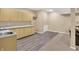 Well-lit wet bar area with ample counter space and storage, adjacent to the living space at 13191 Roma, Carmel, IN 46074
