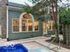 Back of the home featuring a pool, large windows, and a patio at 13262 Landwood Dr, Fishers, IN 46037